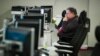 FILE - A workers sits at a computer at the Department of Homeland Security's National Cybersecurity and Communications Integration Center (NCCIC) in Arlington, Va., Aug. 22, 2018. 