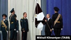 Russia -- Russian President Vladimir Putin and the National Guard chief Viktor Zolotov take part in a ceremony marking National Guard Day in Moscow, March 27, 2017