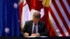 New Zealand’s Minister for Trade and Export Growth David Parker signs the Trans-Pacific Partnership trade deal, in Santiago, Chile, March 8, 2018.
