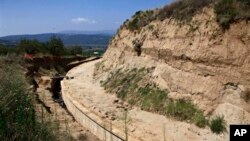 Partial view of the site where archaeologists are excavating an ancient mound in Amphipolis, northern Greece, Aug. 12, 2014.