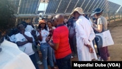 Participants of the Southern African Development Community's energy summit tour a solar project at the Botswana University of Agriculture and Natural Resources on Feb. 28, 2025.