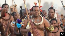 FILE - In this Sept. 3, 2012, photo, Eswatini's King Mswati III, front, dances during a Reed Dance in Mbabane. 