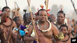 FILE - In this Sept. 3, 2012, photo, Eswatini's King Mswati III, front, dances during a Reed Dance in Mbabane. 