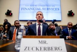 Facebook CEO Mark Zuckerberg arrives for a House Financial Services Committee hearing on Capitol Hill in Washington, Wednesday, Oct. 23, 2019, on Facebook's impact on the financial services and housing sectors. (AP Photo/Andrew Harnik)