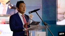 FILE - U.N. Food and Agriculture Organization (FAO) director Qu Dongyu talks during the presentation of the FAO’s State of Food Security and Nutrition in the World annual report in Rio de Janeiro on July 24, 2024.