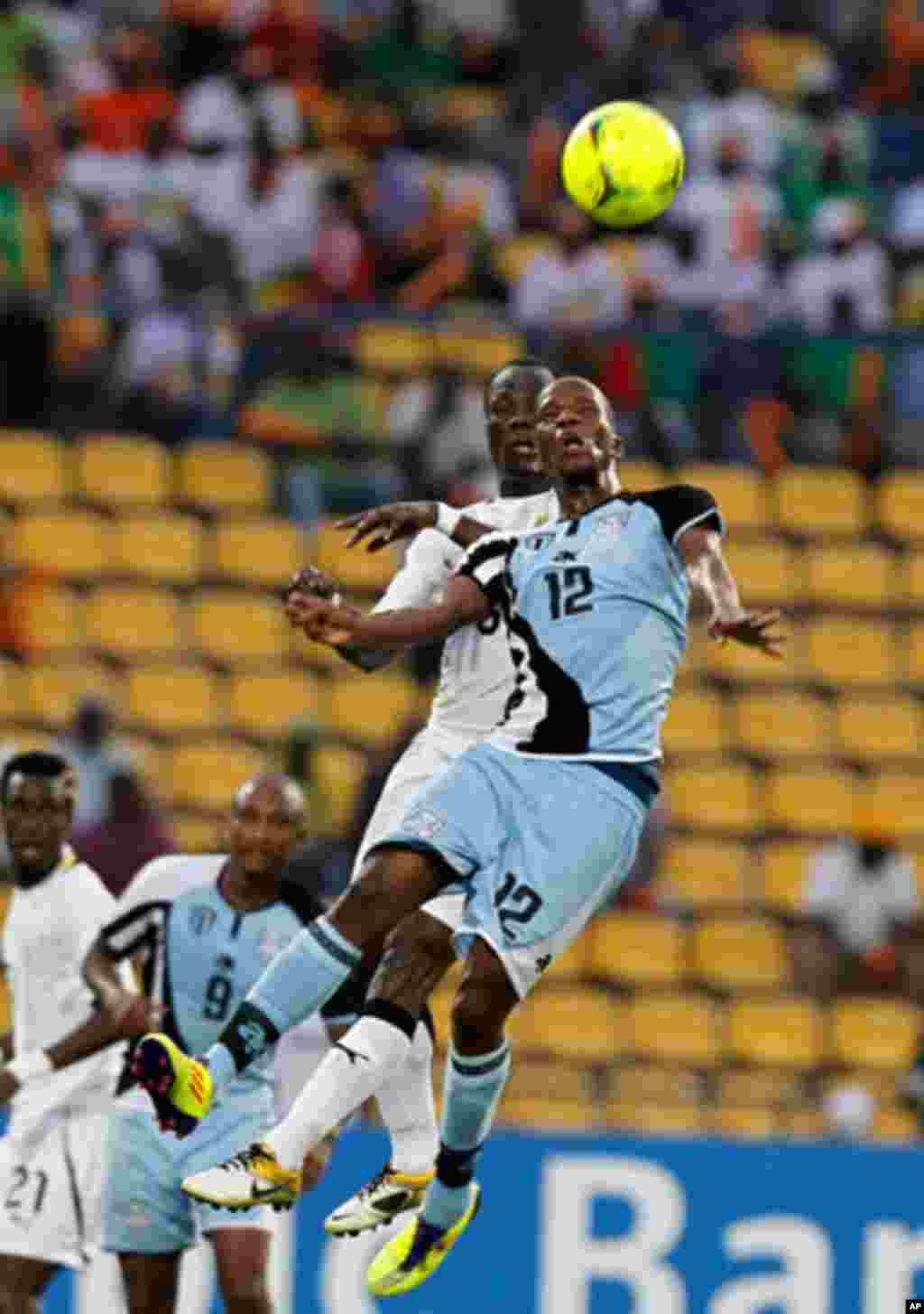 Botswana's Patrick Motsepe (front) challenges Anthony Annan of Ghana during their African Cup of Nations Group D soccer match in FranceVille Stadium.