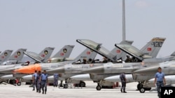 FILE - Dozens of Turkish F-16 jets prepare to take off during Anatolian Eagle exercise at 3rd Main Jet Air Base near the central Anatolian city of Konya.