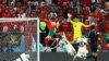 Morocco's Youssef En-Nesyri scores the opening goal against Portugal at the 2022 FIFA World Cup