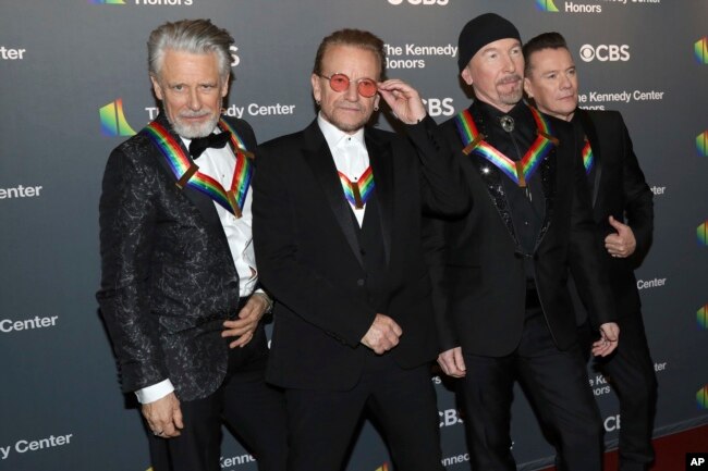 2022 Kennedy Center Honorees, from left, Adam Clayton, Bono, The Edge and Larry Mullen Jr. of U2 arrive at the Kennedy Center Honors on Sunday, Dec. 4, 2022, at The Kennedy Center in Washington. (Photo by Greg Allen/Invision/AP)