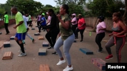 FILE - People exercise inside Warren Hills cemetery in Harare, Zimbabwe, November 24 ,2022. (REUTERS/Philimon Bulawayo)