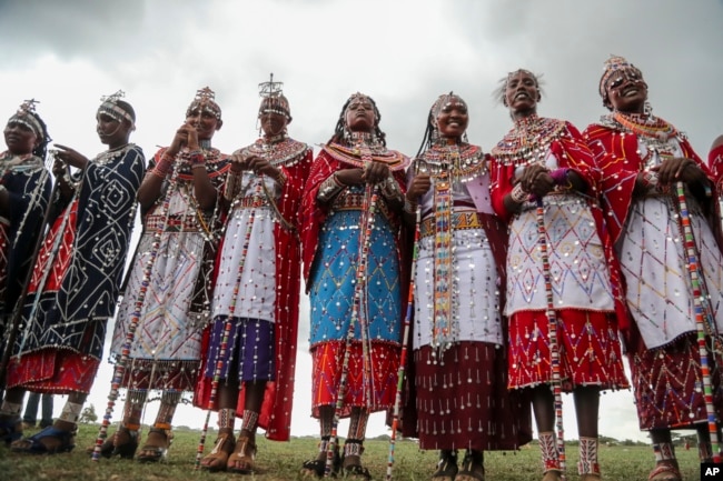 Maasai women spectators watch the Maasai Olympics in Kimana Sanctuary, southern Kenya Saturday, Dec. 10, 2022. (AP Photo/Brian Inganga)