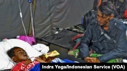 Azka Maulana Malik, age 5, was rescued after being trapped for two days under the rubble of his house in Nagrak Village, Cianjur, Indonesia, Nov. 23, 2022.