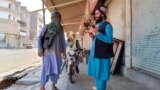 FILE - Taliban fighters patrol in Farah province, southwest of Kabul, Afghanistan, Aug. 11, 2021. Taliban rulers on Dec. 7, 2022, carried out the first public execution of a man charged with murder since returning to power. The execution took place at a stadium in Farah province.