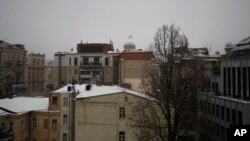 Buildings in central Kyiv as the sound of air defense and explosions are heard across Kyiv, Ukraine, Jan. 14, 2023.