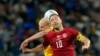Denmark's Christian Eriksen, foreground, and Australia's Aaron Mooy jump for the ball during the World Cup group D soccer match between Australia and Denmark, at the Al Janoub Stadium in Al Wakrah, Qatar, Nov. 30, 2022. 