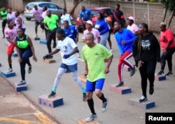People exercise inside Warren Hills cemetery in Harare, Zimbabwe, November 24 ,2022.REUTERS/Philimon Bulawayo