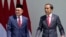Indonesian President Joko Widodo, right, talks with Malaysian Prime Minister Anwar Ibrahim during their meeting at the presidential palace in Bogor, West Java, Indonesia, Monday, Jan. 9, 2023. (AP Photo/Achmad Ibrahim)