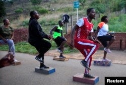 People exercise inside Warren Hills cemetery in Harare, Zimbabwe, November 24 ,2022.REUTERS/Philimon Bulawayo
