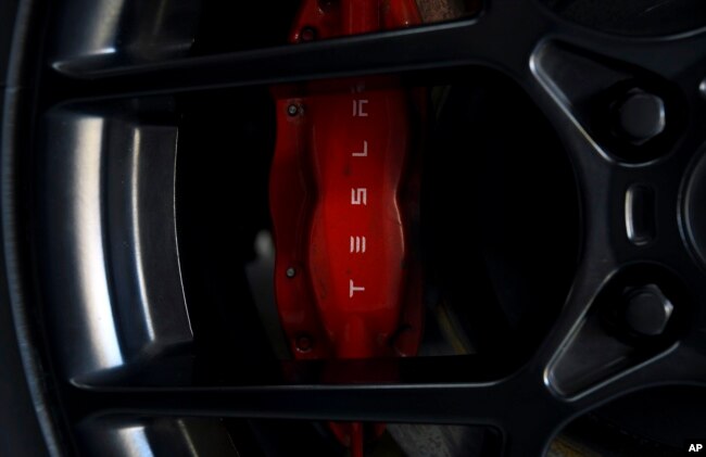 Tesla brakes are seen on Kevin Erickson's 1972 Plymouth Satellite at his Commerce City, Colo., home on Sept. 20, 2022. (AP Photo/Thomas Peipert)