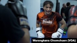 Stamp Fairtex, Thai female fighter, watches participants at a Muay Thai seminar at Impact Martial Arts Academy in Virginia, October, 2022.