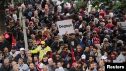 FILE: Demonstrators attend a protest against Tunisian President Kais Saied, on the anniversary of the 2011 uprising, in Tunis, Tunisia January 14, 2023.
