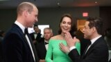 Britain's Prince William and Kate, Princess of Wales, chat with actor Rami Malek, right, at the Earthshot Prize Awards at the MGM Music Hall at Fenway, in Boston, Dec. 2, 2022. 