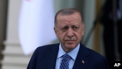 FILE - Turkish President Recep Tayyip Erdogan arrives for a ceremony, in Ankara, Turkey, on May 16, 2022. 