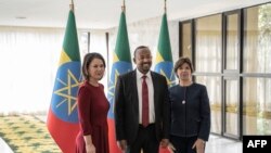 German Foreign Minister Annalena Baerbock (L), Ethiopian Prime Minister Abiy Ahmed (C) and French Foreign Minister Catherine Colonna (R) pose for a photograph at the Prime Minister's office in Addis Ababa, Ethiopia, Jan. 12, 2023.