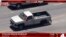 FILE - In this photo from video provided by KNBC-TV a pickup truck that had been reported stolen is pursued by police on Southern California streets and freeways, May 22, 2020.