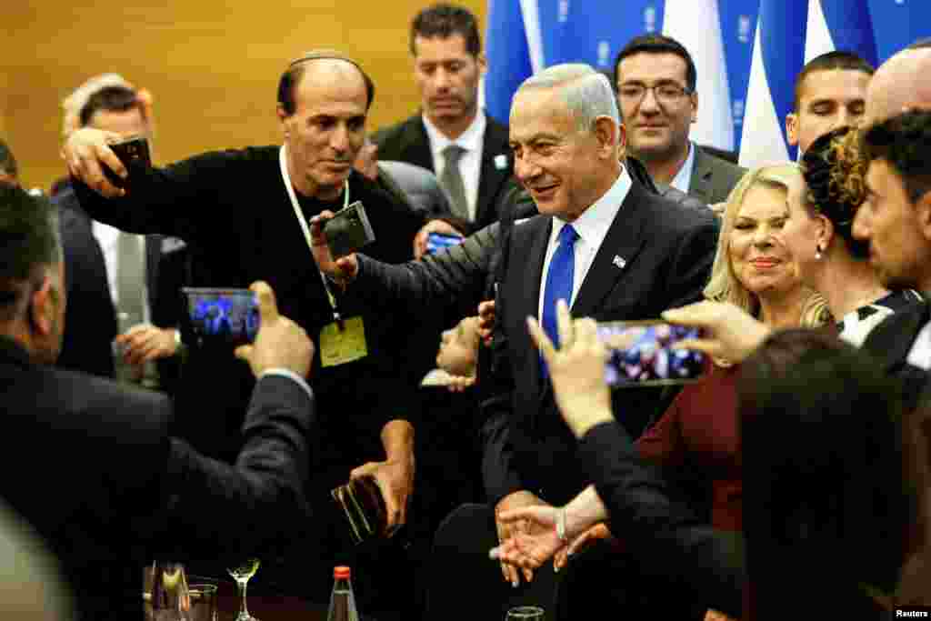 Israeli Prime Minister Benjamin Netanyahu attends a toast for the new Speaker of the Knesset Amir Ohana (unseen) after the new government is sworn in at the parliament, in Jerusalem.&nbsp;