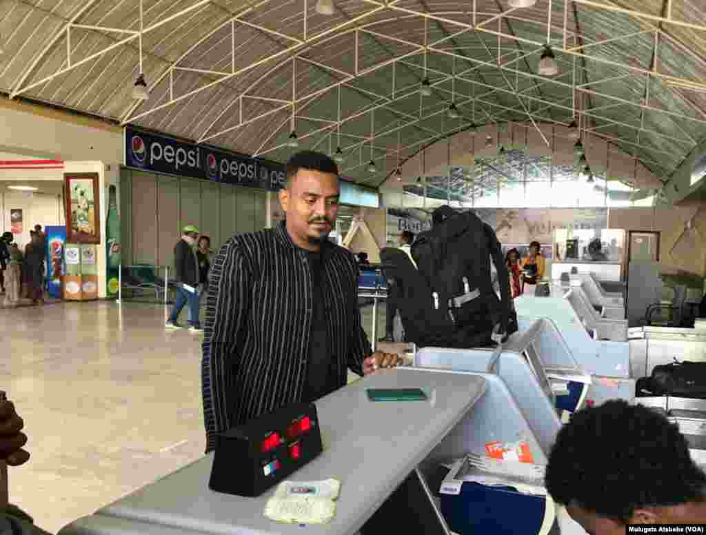 Passenger Checking In For First Ethiopian Airlines Flight to Mekele From Addis Ababa