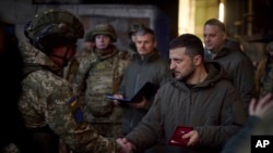 Ukrainian President Volodymyr Zelenskyy awards a serviceman in Bakhmut, Ukraine, Dec. 20, 2022. (Ukrainian Presidential Press Office)