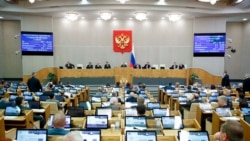 FILE - Russian lawmakers attend a session of the State Duma in Moscow, Nov. 24, 2022. The chamber has passed legislation expanding a 2015 law that broadened the criteria under which foreign-funded nongovernmental organizations are labeled “undesirable.” 