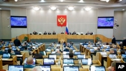 FILE - Russian lawmakers attend a session of the State Duma in Moscow, Nov. 24, 2022. The chamber has passed legislation expanding a 2015 law that broadened the criteria under which foreign-funded nongovernmental organizations are labeled “undesirable.” 