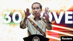 Presiden Joko Widodo saat menyampaikan sambutan pada pertemuan tahunan bank sentral Indonesia dengan para pemangku kepentingan keuangan di Jakarta, 30 November 2022. REUTERS/Willy Kurniawan