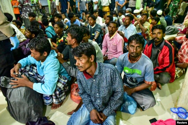 Rohingya refugees wait at a temporary shelter in Pidie, Aceh province, Indonesia, December 26, 2022, in this photo taken by Antara Foto. (Antara Foto/Joni Saputra/via REUTERS)