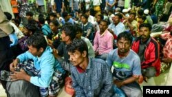 Rohingya refugees wait at a temporary shelter in Pidie, Aceh province, Indonesia, December 26, 2022, in this photo taken by Antara Foto. (Antara Foto/Joni Saputra/via REUTERS)