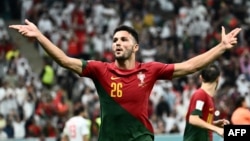 Portugal's Goncalo Ramos celebrates after scoring his third goal and his team's fifth during the Qatar 2022 World Cup round of 16 soccer match against Switzerland at Lusail Stadium north of Doha on Dec. 6, 2022.