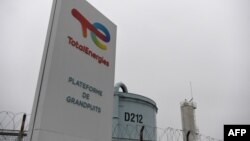 FILE: This photo taken Nov. 21, 2022 shows the entrance sign of a TotalEnergies petroleum facility.