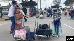 Passengers arriving from Tigray are greeted by relatives at the Bole International Airport in Addis Ababa, Dec. 28, 2022. 