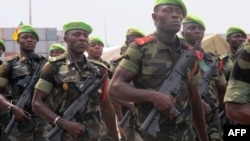 FILE - Cameroonian troops stand in formation in Douala, Feb. 20, 2014.