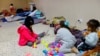 Migrant girls, traveling from Venezuela with their family, play in a shelter near the border between the US and Mexico, after the U.S. Supreme Court said on Tuesday that it will keep Title 42 in force for now, in Ciudad Juarez, Mexico, Dec. 27, 2022. 