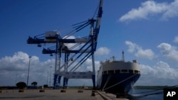 FILE - A ship carrying motor vehicles is seen berthed at Chinese-run Hambantota International Port in Hambantota, Sri Lanka, Aug. 16, 2022.