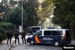 Police stands outside of Ukrainian embassy after, Spanish police said, blast at embassy building injured one employee while handling a letter, in Madrid, Spain November 30, 2022. REUTERS/Juan Medina