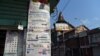 FILE - In this Jan. 29, 2022, photo, local newspapers hang from a newsstand in Srinagar, India.
