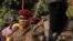 FILE - Captain Ibrahim Traore, Burkina Faso's new president, leaves the ceremony for the 35th anniversary of Thomas Sankara's assassination, in Ouagadougou, October 15, 2022.