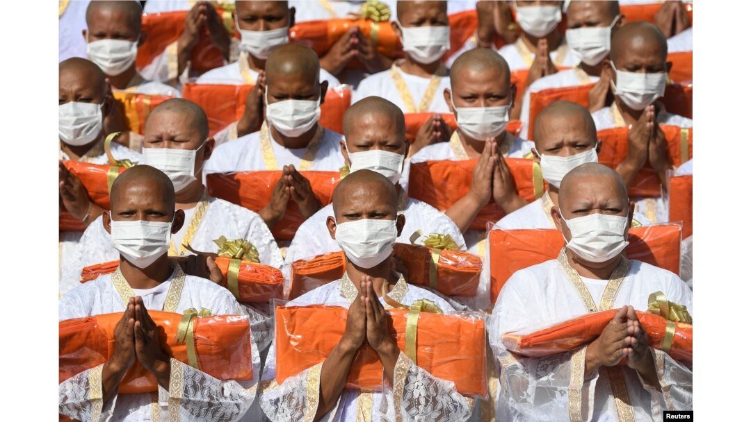 Officials pay their respects to Thailand's Princess Bajrakitiyabha Narendira Debyavati, as she has been hospitalized due to a heart problem, during a mass Buddhist novice monk ordination ceremony at Sukanthawat temple in Samut Prakan, Thailand, Dec. 20, 2022.