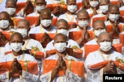 Officials pay their respects to Thailand's Princess Bajrakitiyabha Narendira Debyavati, as she has been hospitalized due to a heart problem, during a mass Buddhist novice monk ordination ceremony at Sukanthawat temple in Samut Prakan, Thailand, Dec. 20, 2022.