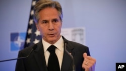 FILE - U.S. Secretary of State Antony Blinken gestures during a press conference held as part of a NATO foreign ministers meeting in Bucharest, Romania, Nov. 30, 2022.