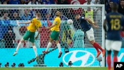 Olivier Giroud, right, scores France's fourth goal and his second of the match in a 4-1 victory over Australia at the World Cup in Al Wakrah, Qatar, Nov. 22, 2022.